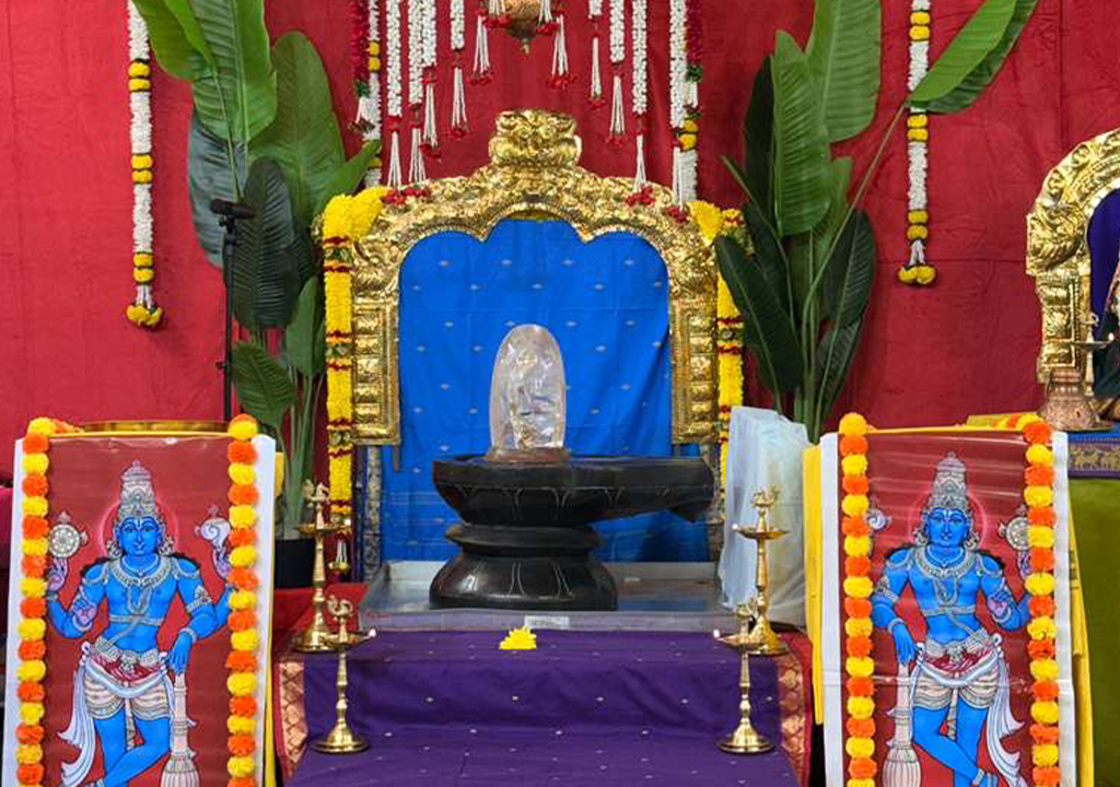 Sacred Shiva Lingam altar adorned with flowers and banana leaves during a special pooja at Hari Hara Kshethram.